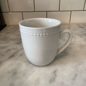 Set of four white mugs